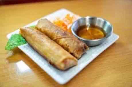 Crispy egg rolls served with sweet chili dipping sauce
